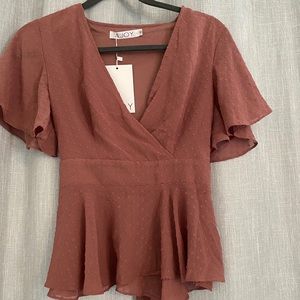 Adorable peplum shirt